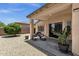 Inviting backyard patio with stone gravel, seating and potted plants at 4332 E Cassia Ln, Gilbert, AZ 85298