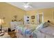 Bedroom with yellow walls and views into other rooms of the home at 4332 E Cassia Ln, Gilbert, AZ 85298