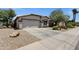 Well-kept home featuring low-maintenance landscaping and attached garage at 4332 E Cassia Ln, Gilbert, AZ 85298
