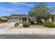 Inviting single-story home with a two-car garage and mature landscaping at 4332 E Cassia Ln, Gilbert, AZ 85298