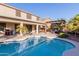A beautiful backyard pool and patio area offering a relaxing outdoor space for lounging and entertaining at 43615 W Roth Rd, Maricopa, AZ 85138