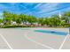 Well-maintained community basketball court with multiple hoops and plenty of space to play on a sunny day at 43615 W Roth Rd, Maricopa, AZ 85138