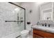 Elegant bathroom featuring a glass-enclosed shower and granite countertop vanity at 43615 W Roth Rd, Maricopa, AZ 85138