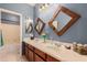 Stylish bathroom with double sinks, custom mirrors, and plenty of vanity space at 43615 W Roth Rd, Maricopa, AZ 85138