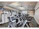 Well-equipped gym with modern cardio machines and weight training equipment, perfect for fitness enthusiasts at 43615 W Roth Rd, Maricopa, AZ 85138