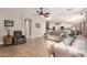 Open concept living room showcasing hardwood floors and views to the kitchen at 43615 W Roth Rd, Maricopa, AZ 85138