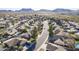 Aerial view showcases well-maintained homes, lush landscaping and desert views at 4407 W Avenida Del Sol --, Glendale, AZ 85310