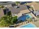 Aerial view of backyard featuring a refreshing pool, green grass, and patio perfect for outdoor living at 4407 W Avenida Del Sol --, Glendale, AZ 85310
