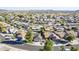 Aerial view showcases well-maintained homes, lush landscaping and desert views at 4407 W Avenida Del Sol --, Glendale, AZ 85310