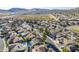 Community aerial view showcases well-maintained homes, lush landscaping and desert views at 4407 W Avenida Del Sol --, Glendale, AZ 85310