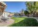 Private backyard with lush landscaping, a sparkling pool, and a patio area for outdoor relaxation at 4407 W Avenida Del Sol --, Glendale, AZ 85310