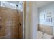 Bright bathroom featuring a tiled shower and a separate soaking tub for relaxation at 4407 W Avenida Del Sol --, Glendale, AZ 85310