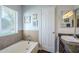 Bright bathroom with bathtub, modern fixtures, and decorative accents; featuring tile floors at 4407 W Avenida Del Sol --, Glendale, AZ 85310