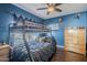 Stylish bedroom with a bunk bed, hardwood floors, and a ceiling fan for added comfort at 4407 W Avenida Del Sol --, Glendale, AZ 85310