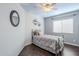 Calming bedroom with cloud painted ceiling, hardwood floors, and a silver metal bed frame at 4407 W Avenida Del Sol --, Glendale, AZ 85310