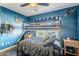 Stylish bedroom with a bunk bed, hardwood floors, and a ceiling fan for added comfort at 4407 W Avenida Del Sol --, Glendale, AZ 85310