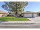 Traditional home featuring a three-car garage, a well-manicured lawn, and a charming front entry at 4407 W Avenida Del Sol --, Glendale, AZ 85310