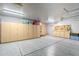 Spacious garage features ample cabinet storage and well-lit interiors, perfect for organization and projects at 4407 W Avenida Del Sol --, Glendale, AZ 85310