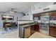 Open-concept kitchen offers stainless steel appliances and granite countertops at 4407 W Avenida Del Sol --, Glendale, AZ 85310