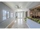 Sunroom with tile floors and many windows leading to pool area and featuring kitchen pass-through at 4407 W Avenida Del Sol --, Glendale, AZ 85310