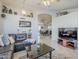 Bright and inviting living room with neutral colors and stylish decor, open to the dining area at 4407 W Avenida Del Sol --, Glendale, AZ 85310