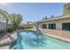 Sparkling backyard pool surrounded by lush greenery, offering a private oasis for relaxation and enjoyment at 4407 W Avenida Del Sol --, Glendale, AZ 85310