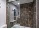 Modern shower with sleek glass doors and stylish tiling at 4443 W Acoma Dr, Glendale, AZ 85306