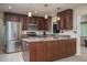 Updated kitchen with stainless steel appliances, custom cabinets, and granite countertops at 4443 W Acoma Dr, Glendale, AZ 85306