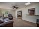 Inviting living room with comfortable seating, view to dining area and natural light at 4443 W Acoma Dr, Glendale, AZ 85306