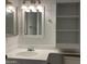 Neat bathroom with stylish vanity, mirror, and built-in storage at 461 W Holmes Ave # 271, Mesa, AZ 85210