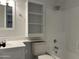 White bathroom featuring shower-tub combo, mirrored vanity, shelving storage and tile flooring at 461 W Holmes Ave # 271, Mesa, AZ 85210
