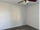 Bedroom featuring hardwood-style flooring, neutral paint, a ceiling fan and ample natural light at 461 W Holmes Ave # 271, Mesa, AZ 85210