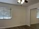 Inviting bedroom boasts natural light, a ceiling fan, and ample closet space at 461 W Holmes Ave # 271, Mesa, AZ 85210