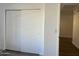 Hallway closet with sliding doors and neutral paint at 461 W Holmes Ave # 271, Mesa, AZ 85210