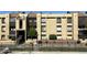 Exterior view of condo with multiple units and fenced pool at 461 W Holmes Ave # 271, Mesa, AZ 85210