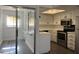 Kitchen view near breakfast nook with stainless steel appliances and white cabinets at 461 W Holmes Ave # 271, Mesa, AZ 85210