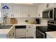 Bright kitchen features white cabinetry, stainless steel appliances, and ample counter space at 461 W Holmes Ave # 271, Mesa, AZ 85210