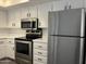 Functional kitchen featuring stainless steel appliances and ample cabinet space at 461 W Holmes Ave # 271, Mesa, AZ 85210