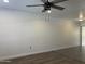Open living space with a stylish ceiling fan and neutral tones at 461 W Holmes Ave # 271, Mesa, AZ 85210
