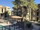 Inviting pool area featuring a gazebo and lush landscaping for relaxation and outdoor enjoyment near apartment buildings at 461 W Holmes Ave # 271, Mesa, AZ 85210