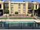 Exterior view of condo with fenced pool at 461 W Holmes Ave # 271, Mesa, AZ 85210