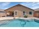 Inviting backyard oasis with private pool, covered patio, and well-maintained landscaping at 471 W Gascon Rd, San Tan Valley, AZ 85143