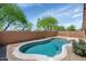 Private backyard features a refreshing pool and mature green trees at 471 W Gascon Rd, San Tan Valley, AZ 85143