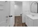 Bathroom featuring wood-look flooring, a shower/tub, and a vanity with sink and modern fixtures at 471 W Gascon Rd, San Tan Valley, AZ 85143