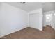 Bright bedroom features neutral carpet, closet and fresh white walls at 471 W Gascon Rd, San Tan Valley, AZ 85143