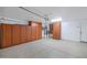 Spacious garage with lots of cabinets and bright lighting at 471 W Gascon Rd, San Tan Valley, AZ 85143