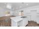 Open kitchen with an island flows into the living area at 471 W Gascon Rd, San Tan Valley, AZ 85143