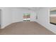Bright living area with neutral carpet and access to pool area at 471 W Gascon Rd, San Tan Valley, AZ 85143