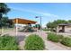 Community playground with shaded play area, benches, and recreational space at 471 W Gascon Rd, San Tan Valley, AZ 85143