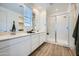 Bright bathroom featuring double sinks with white cabinets and a spacious glass shower at 4755 E French Rd, San Tan Valley, AZ 85143